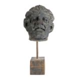 A 16th century carved stone head Naturalistically modelled as a male, with prominent facial