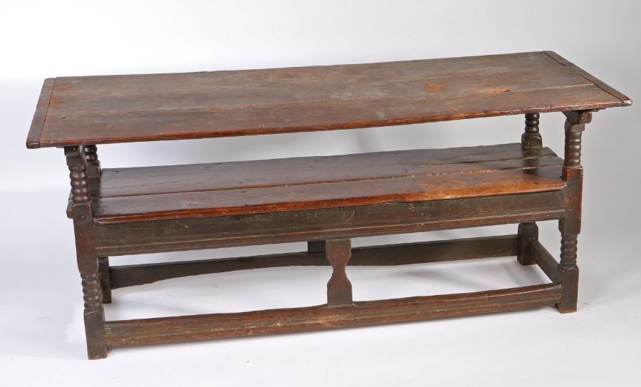 A Charles II oak table settle, circa 1680 Having a boarded and end-cleated back/top, on four ball- - Image 6 of 6