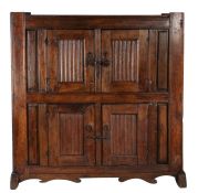 A 16th century and later joined oak livery cupboard, German Having two pairs of simple linenfold-