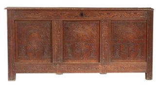 A Charles II oak coffer, circa 1670, Devon Having a boarded lid, the front of three panels, each
