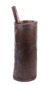 An 18th century chestnut floor standing mortar and pestle The tall cylindrical and iron bound mortar