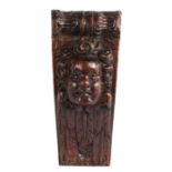 An Elizabeth I carved oak corbel, circa 1600 Designed as an angel mask, atop feathered wings, and