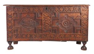 An unusual Elizabeth I joined oak coffer, North Country, dated 1602 Having a reeded and ovolo-