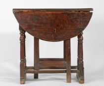 A William & Mary oak gateleg occasional table, circa 1690 Having an oval drop-leaf top formed from