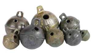 A group of 17th/18th century cast bronze alloy crotal bells, English All spherical with loose