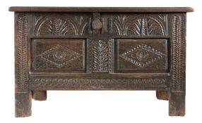 An Elizabeth I joined oak coffer, West Country, circa 1600 The twin-panelled lid with particularly