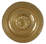 A large brass 16th century alms dish, Nuremberg, circa 1500-1550 Centred by a raised boss with a