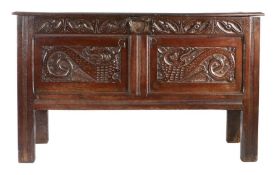 A Charles I joined oak coffer, West Country, circa 1640 Having a boarded top with moulded edge,