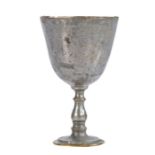 An 18th century miniature tinned latten chalice, English Having a large plain cup on a baluster