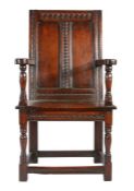 A rare and fine James I cedar double panel-back caqueteuse armchair, West Country, probably