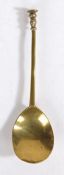 An early 17th century latten gadrooned and scroll-baluster seal-knop spoon, English, circa 1600-20