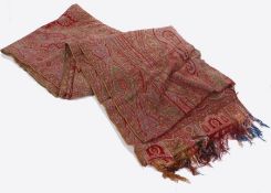 A late 19th century Norwich silk Paisley pattern shawl, significant damage, 266cm x 163cm