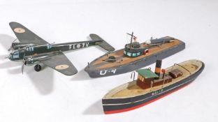 Mid 20th Century painted toys, to include a painted wooden bomber numbered FL 7V, together with a U4
