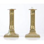 A pair of George III brass candlesticks, circa 1780, with fluted stems and spayed beaded bases, 15cm