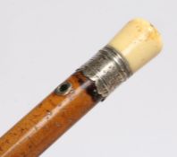 A named and dated Queen Anne period walking cane/stick, the ivory top above a silver collar dated