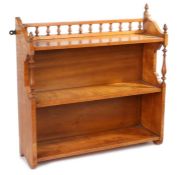A set of Victorian satinwood hanging shelves, the finial gallery top above three shelves, 61cm wide,