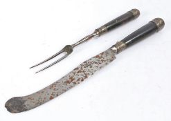 An 18th Century steel bladed knife and fork, with wooden handles and silver foiled collar and