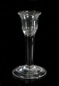 A George III cordial glass, the small bowl above a thick stem and folded foot with pontil mark, 12cm