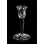 A George III cordial glass, the small bowl above a thick stem and folded foot with pontil mark, 12cm