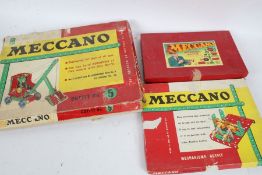 Three Meccano boxed sets, to include Outfit No.5, Mechanisms Outfit, and Accessory Outfit, all boxed