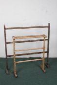 Late 19th century pine towel rail, and a painted pine example (2)