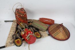 Collection of Eastern works of art, to include a carved wooden and painted face mask, straw work