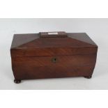 Victorian mahogany tea caddy, of sarcophagus form, the hinged lid enclosing a three section