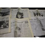 Selection of issues of The Daily Telegraph with historic headlines including, the dropping of the