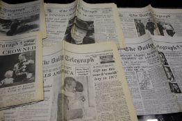 Selection of issues of The Daily Telegraph with historic headlines including, the dropping of the