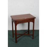 20th century mahogany card table, the rectangular top opening to reveal a green baize interior above