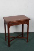 20th century mahogany card table, the rectangular top opening to reveal a green baize interior above
