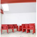 A set of six Swedish red leather armchairs, by Kinnarps, crca 1988, raised on chromed supports to