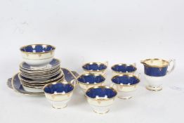 Collection of Crown Staffordshire porcelain teaware, with a blue and white ground and gilt border,