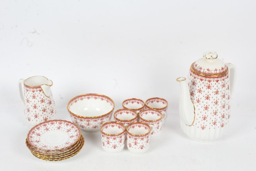 Spode Fleur De Lys bone china coffee set in red, comprising coffee pot, six each cups and saucers,