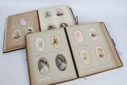 Two Victorian carte de visite and photograph albums, each leather bound with contents (2)