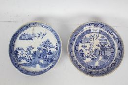 Two 19th century blue and white tazzas, both depicting scenes of pagodas, the largest 23cm