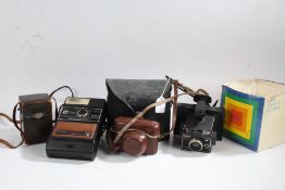 Cameras to include Kodak EK2300 instant, Polaroid Colorpack 32 land camera, Polaroid Swinger model