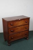 Victorian mahogany chest of drawers, consisting of three long graduating drawers, raised on turned