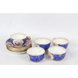 Derby porcelain hand painted tea set consisting of five cups and saucers with a blue and gilt ground