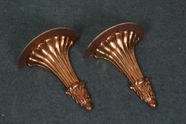 Pair of Rococo style gilt wall brackets, with a semicircular top above a reeded tapering body and