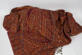 Large paisley pattern shawl, decorated with a floral design on a orange ground, approx 240cm wide