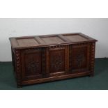 17th century style coffer that has been converted into a cupboard, with a carved front decorated