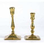 Two early 18th century brass candlesticks, English, circa 1720 Both seamed, with balustroid stem and