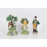 19th century Staffordshire pearlware figure group of Songsters, each beneath a bocage, 21cm tall,