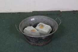 Galvanised twin handled bowl with contents of artificial eggs