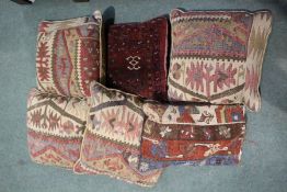 Set of four rug and cord cushions, and two others (6)