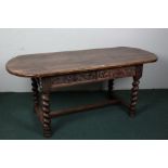 20th century oak refectory dining table, with a rounded plank top above scroll carved frieze and