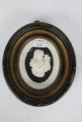 19th century plaster plaque depicting Baccante, housed within a oval frame, 24cm by 20cm
