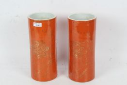 Pair of modern Chinese vases, of cylindrical form, with gilt flowers on an orange ground, marks to