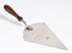 Silver plated presentation trowel, the turned wooden handle above shaped blade engraved "Presented